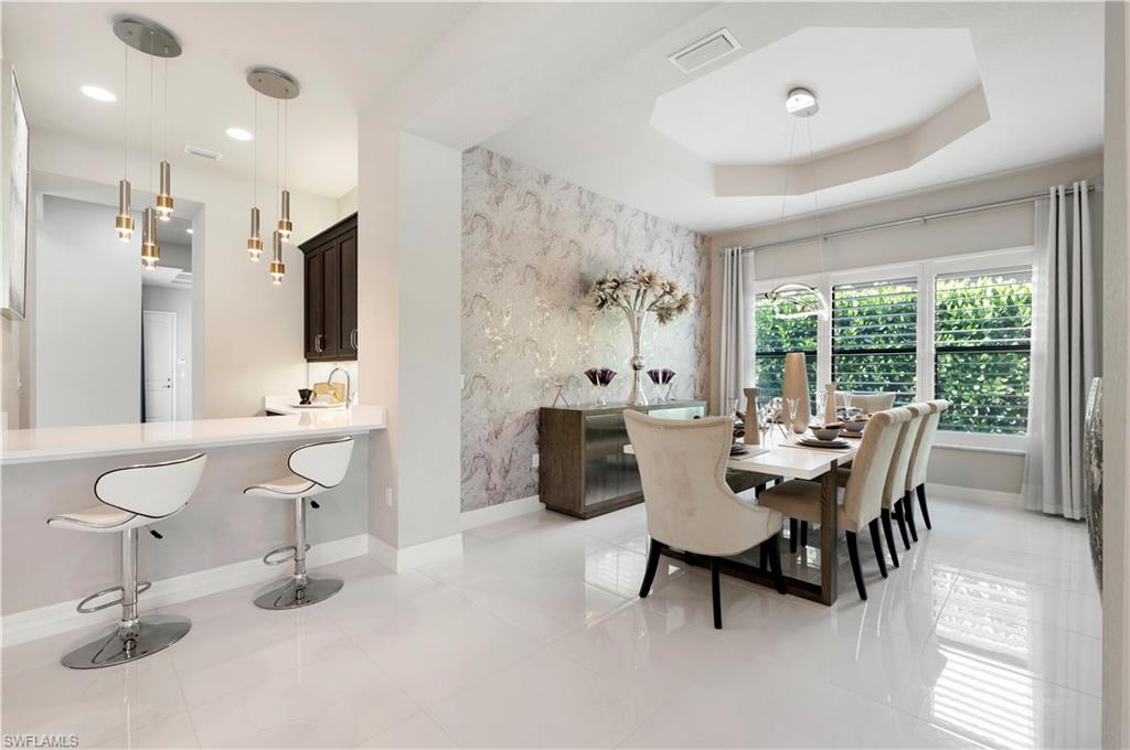 4462 Caldera Circle Naples, FL 34119 - Photo 14 of 33 a view of a dining room with furniture window and outside view