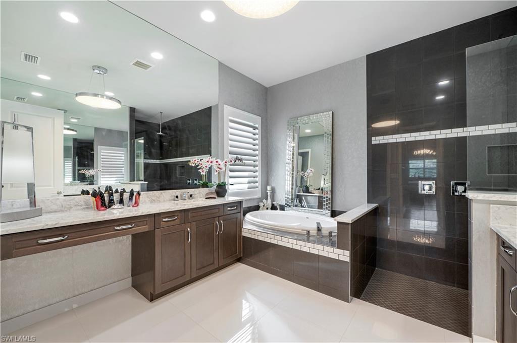 4462 Caldera Circle Naples, FL 34119 - Photo 20 of 33 a large kitchen with a large counter top appliances and cabinets