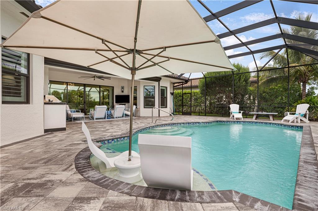 4462 Caldera Circle Naples, FL 34119 - Photo 5 of 33 a view of a patio with dining table and chairs