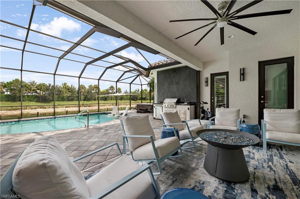 4462 Caldera Circle Naples, FL 34119 - Photo 7 of 33 a living room with couch and a large window