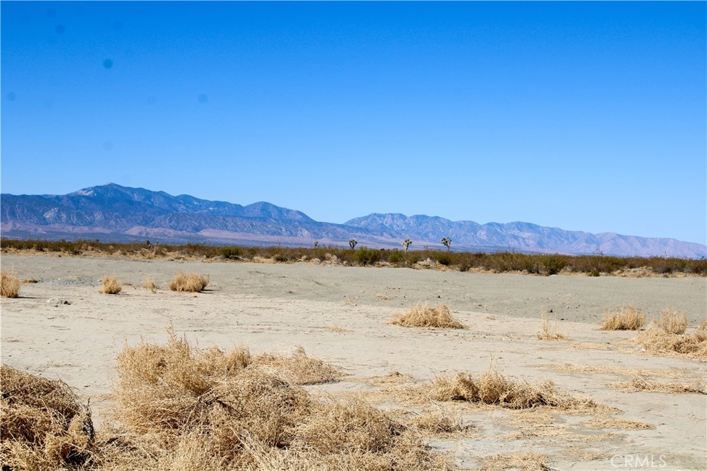 5-ac Sheep Creek Road Phelan, CA 92371 - Photo 6 of 12 a view of lake with mountain