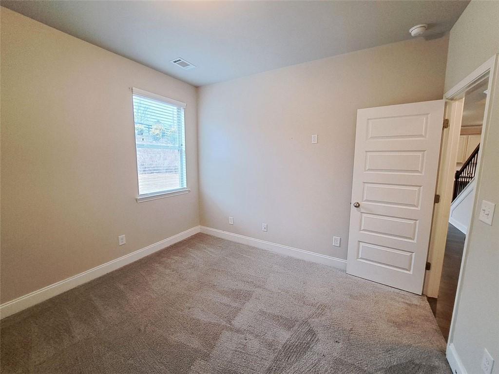 512 Hinton Farm Wy. Way Dacula, GA 30019 - Photo 16 of 30 an empty room with a window