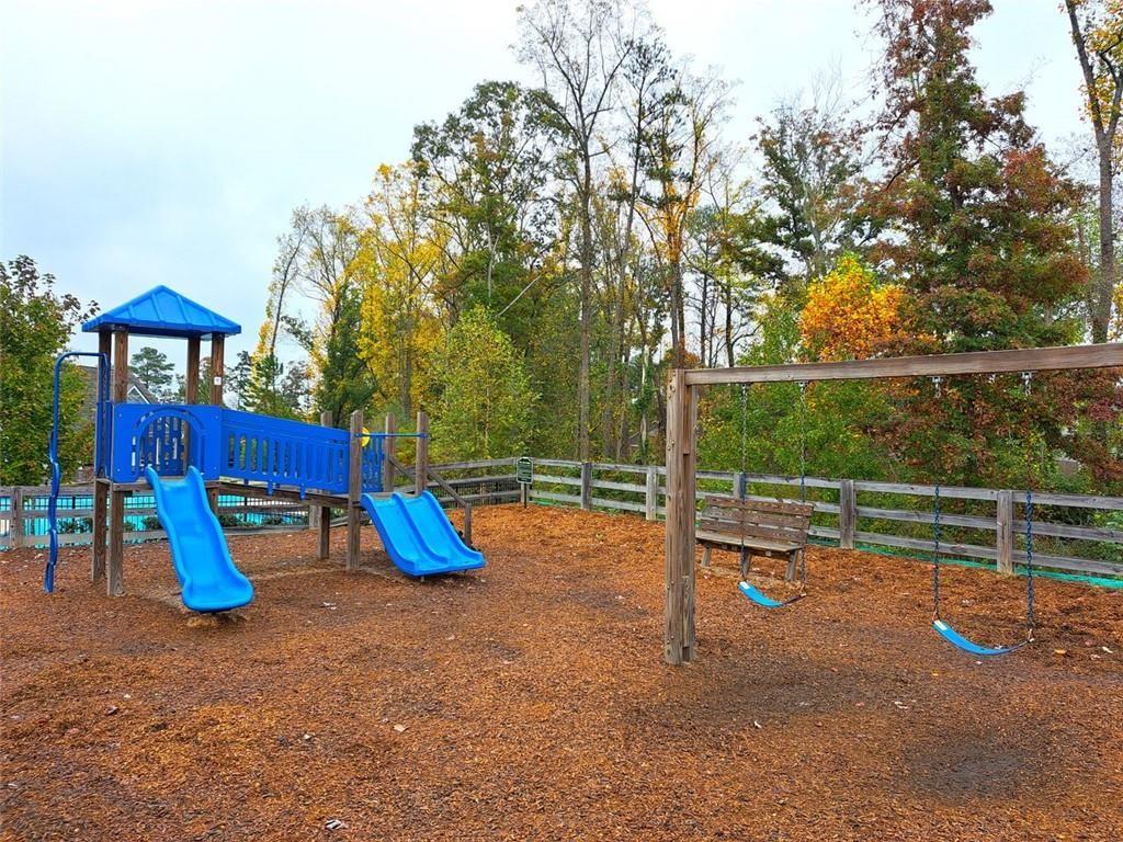 512 Hinton Farm Wy. Way Dacula, GA 30019 - Photo 29 of 30 a view of outdoor space with playground and green space