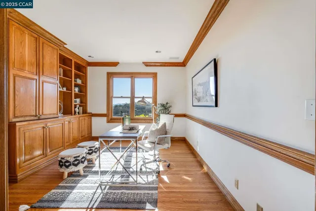 a bedroom with furniture and wooden floor