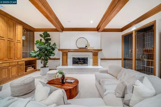 a spacious bedroom with a bed and a chandelier