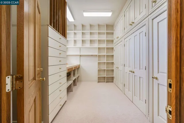 a spacious bedroom with a bed and a couch