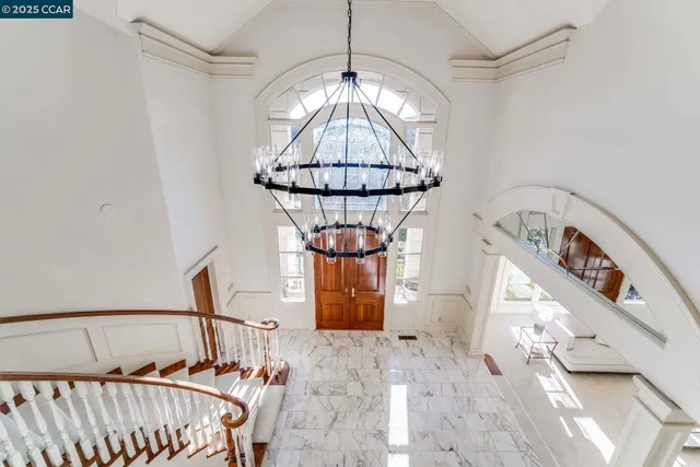 a view of a livingroom with furniture and a flat screen tv