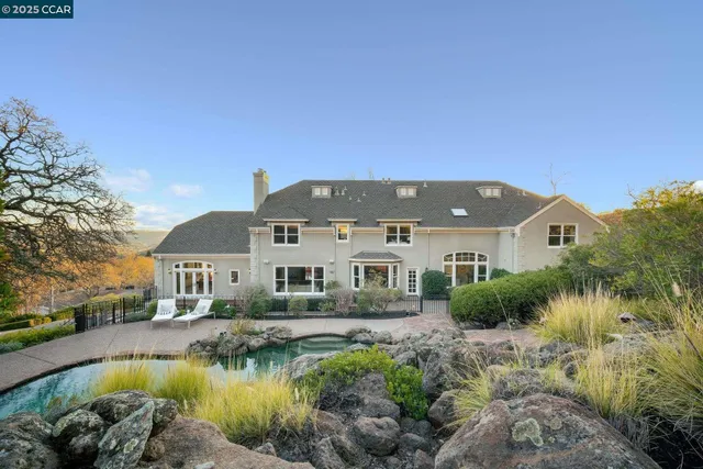 a bathroom with a shower sink vanity mirror and toilet