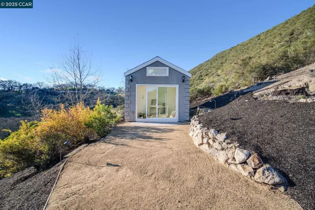 a view of a garden with a patio