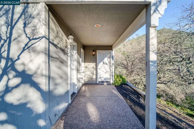 a view of a bench in middle of the green field
