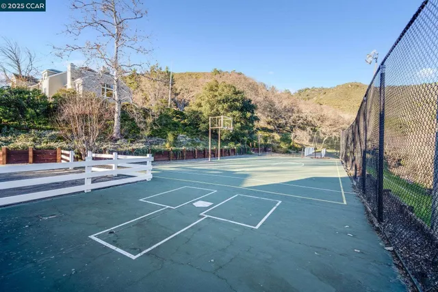 a sign that is sitting in front of flowers