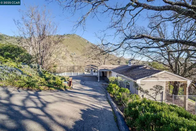 a view of a balcony with chairs