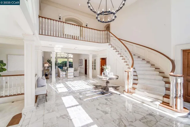 a view of entryway livingroom and hall with wooden floor