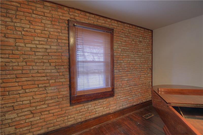 380 Chapin Road New Castle, PA 16105 - Photo 4 of 20 Den has brick interior wall, built-in cabinets and fireplace!