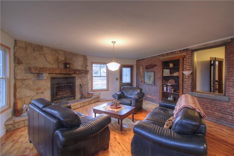 380 Chapin Road New Castle, PA 16105 - Photo 5 of 20 Kitchen open to family room with custom built fireplace - stones hewn on-site!