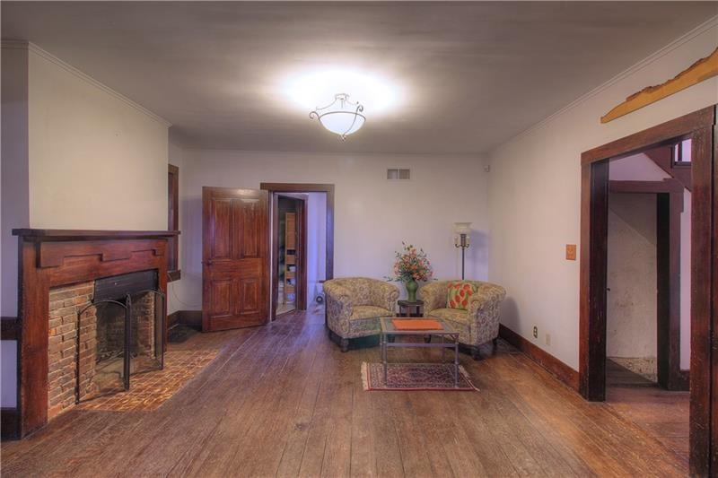 380 Chapin Road New Castle, PA 16105 - Photo 7 of 20 Formal living room with brick fireplace - opens up to formal dining room!