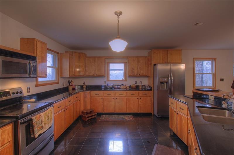 380 Chapin Road New Castle, PA 16105 - Photo 9 of 20 Custom tiger maple cabinets and custom hardwood and granite floors and countertops