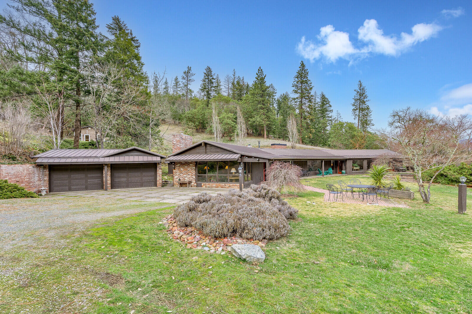 2128 Anderson Creek Road Talent, OR 97540 - Photo 7 of 87 a view of a house with a big yard and large trees