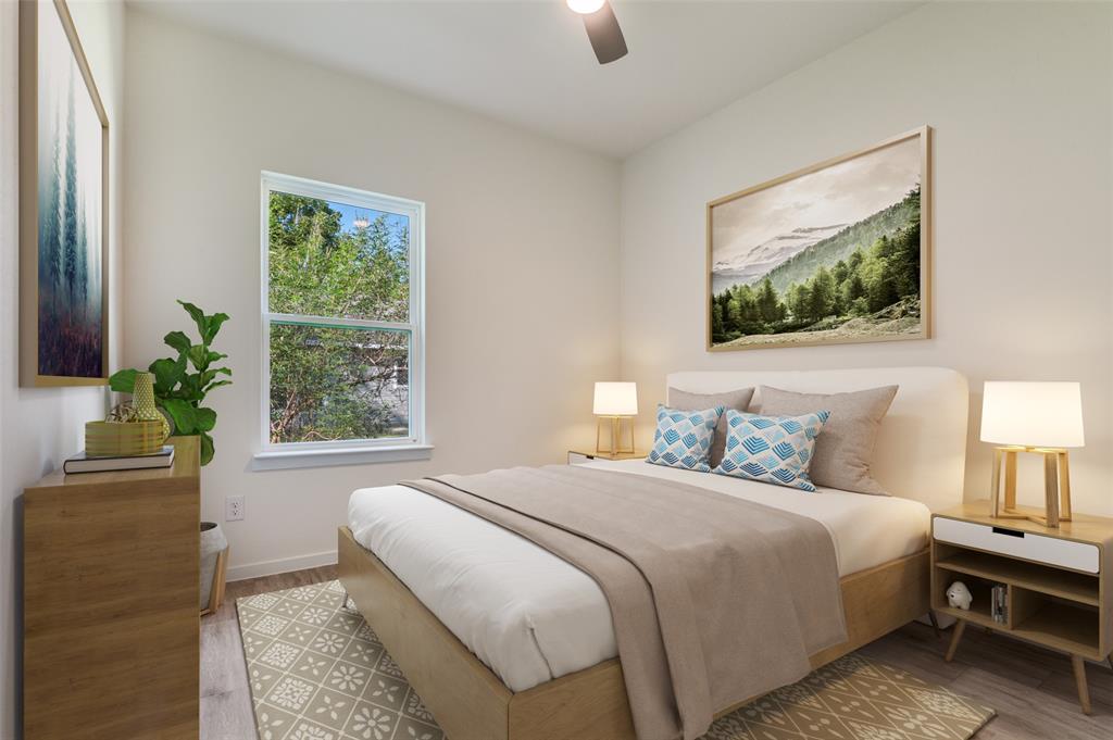 608 Southwest 3rd Street Kerens, TX 75144 - Photo 15 of 25 Bedroom featuring light wood-style floors and a ceiling fan