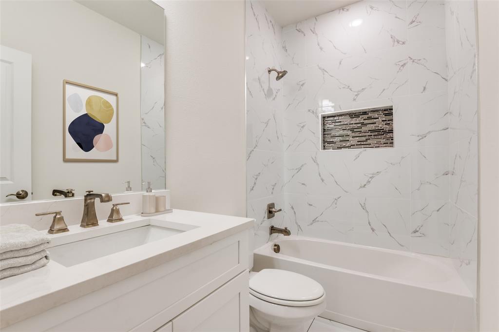 608 Southwest 3rd Street Kerens, TX 75144 - Photo 17 of 25 Full bathroom with shower / washtub combination and vanity
