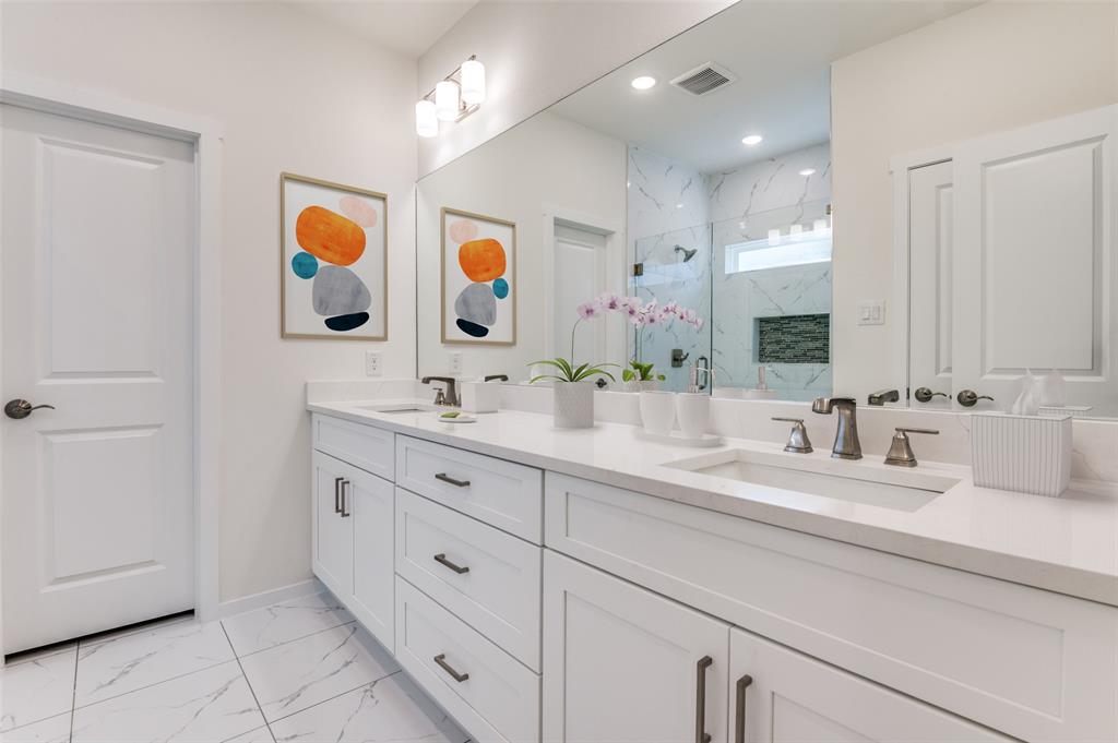 608 Southwest 3rd Street Kerens, TX 75144 - Photo 20 of 25 Bathroom with light marble finish flooring, a marble finish shower, and double vanity