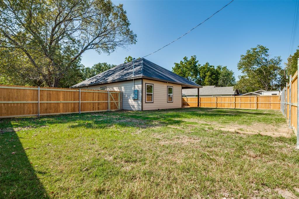 608 Southwest 3rd Street Kerens, TX 75144 - Photo 24 of 25 Rear view of property with a fenced backyard