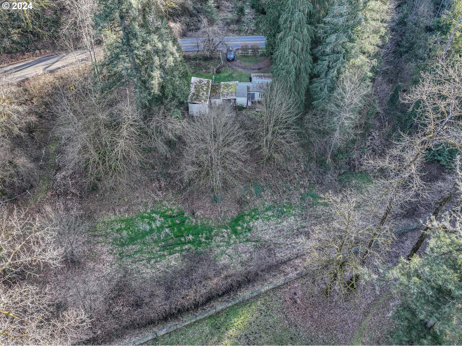 11112 Southeast Lusted Road Sandy, OR 97055 - Photo 13 of 21 a backyard of a house with lots of green space and fog