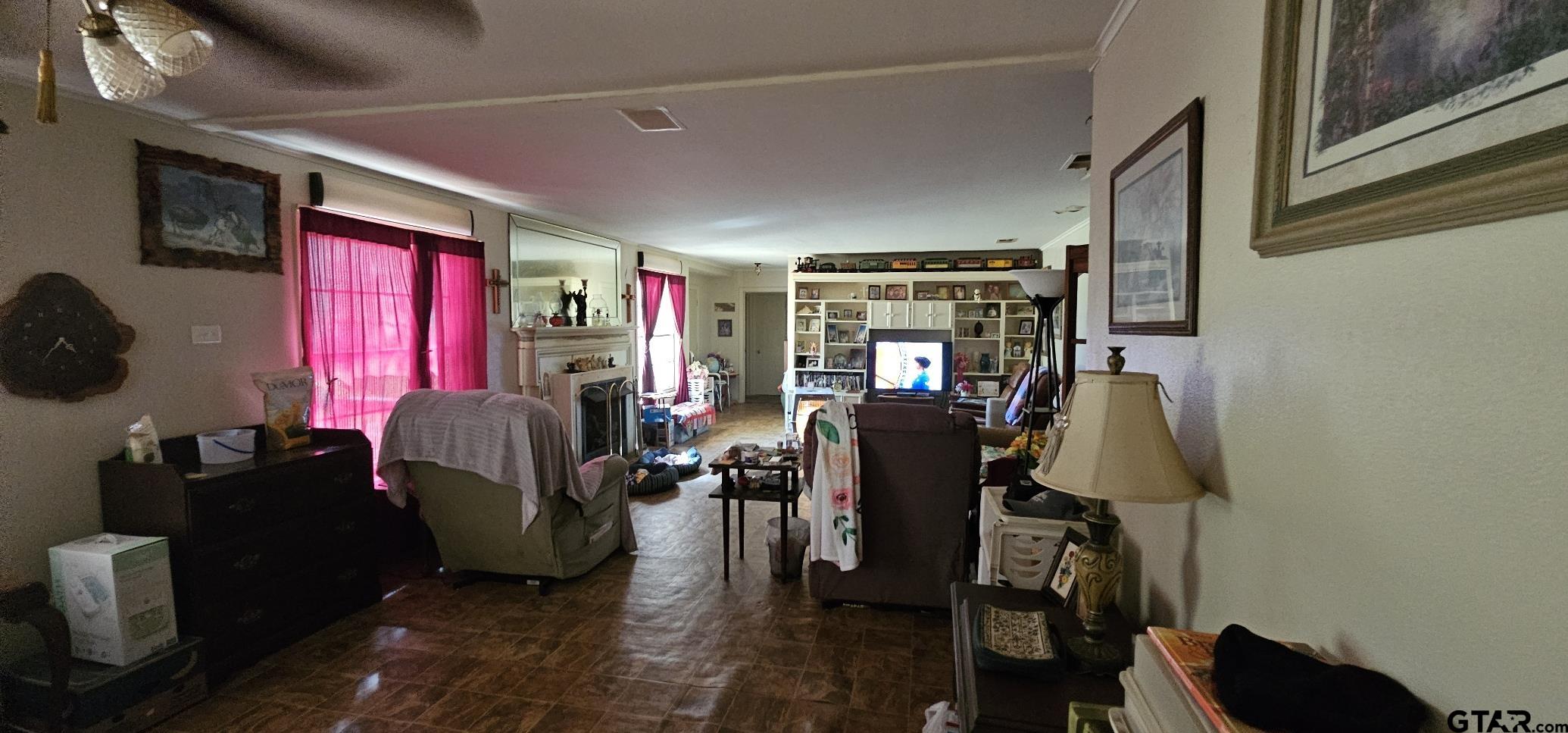 4269 Highway 21 Alto, TX 75925 - Photo 14 of 41 a living room with furniture a flat screen tv and gym equipment