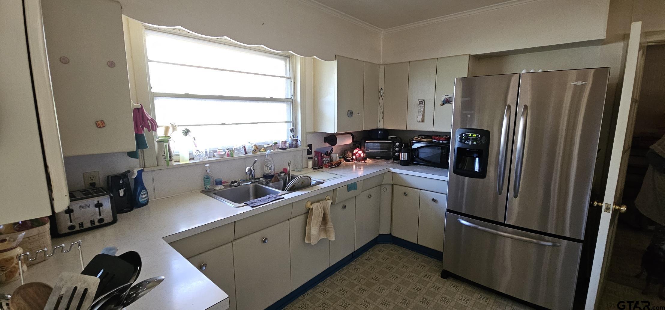 4269 Highway 21 Alto, TX 75925 - Photo 15 of 41 a kitchen with a refrigerator and a sink