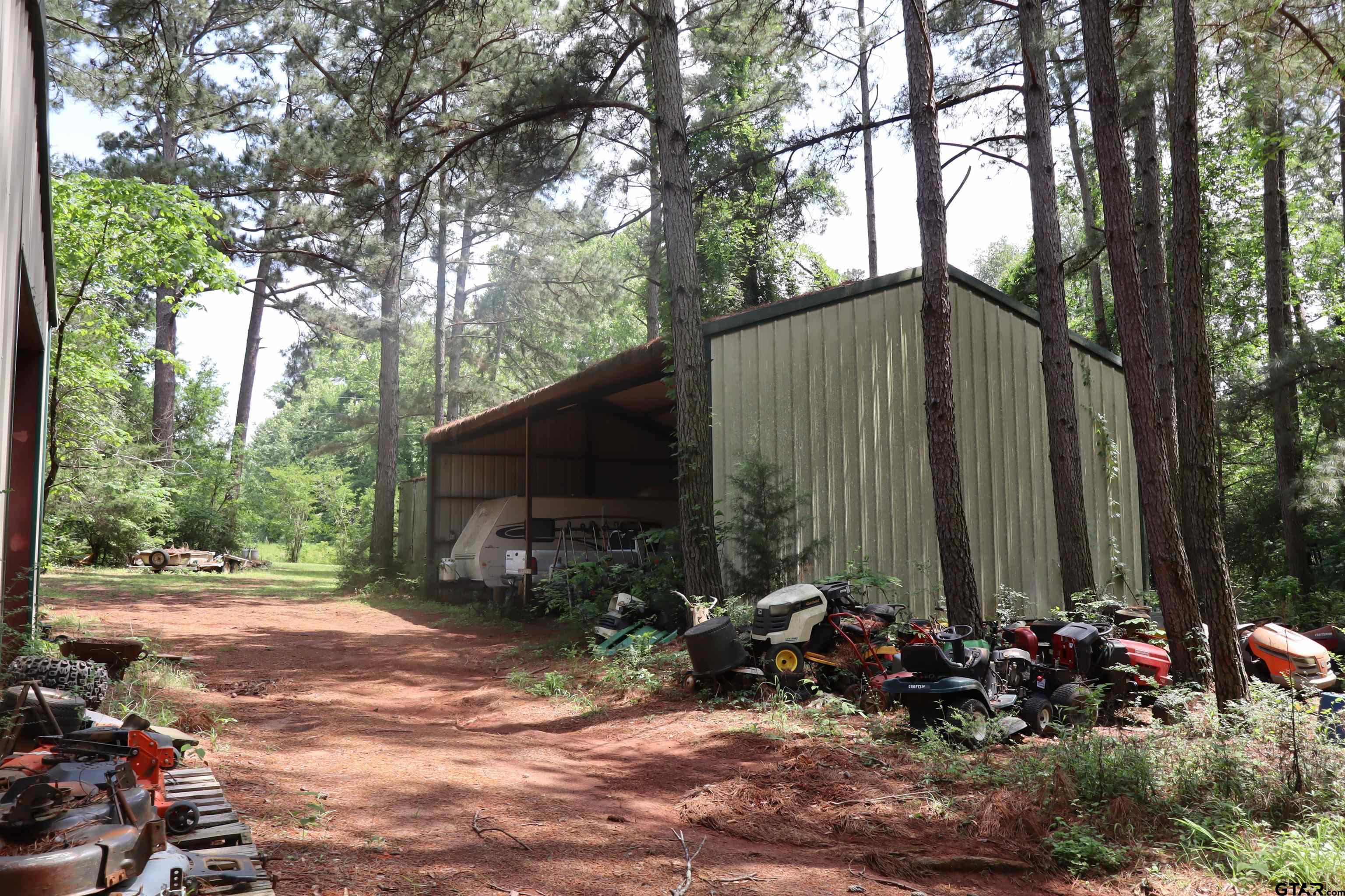 4269 Highway 21 Alto, TX 75925 - Photo 28 of 41 a backyard of a house with barbeque oven and outdoor seating