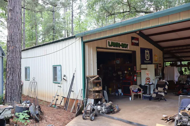 a backyard of a house with yard and outdoor seating