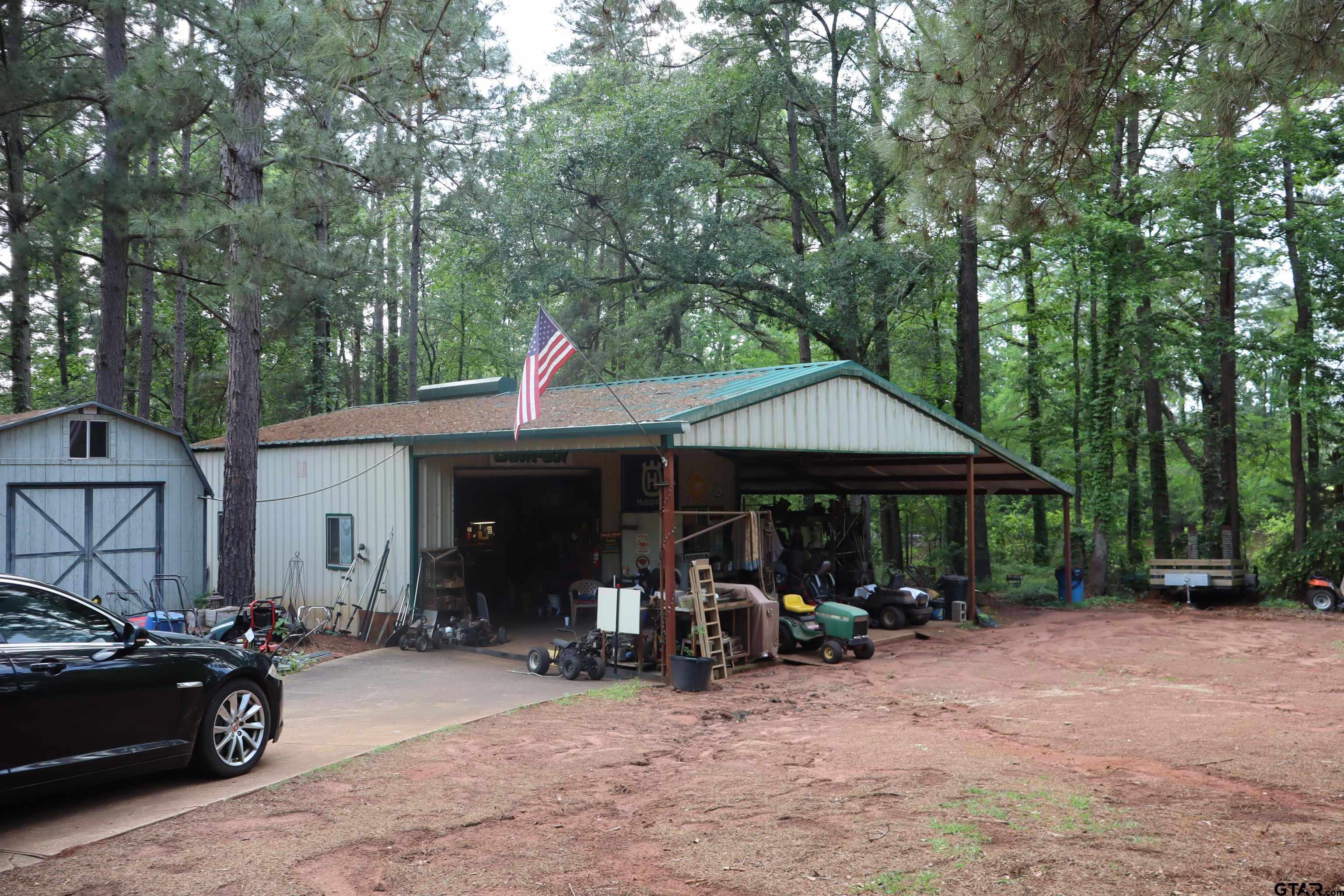 4269 Highway 21 Alto, TX 75925 - Photo 32 of 41 a view of a patio with table and chairs under an umbrella