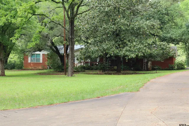 a view of a backyard with a garden
