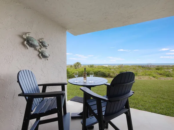 a view of a dining room with furniture window and garden view