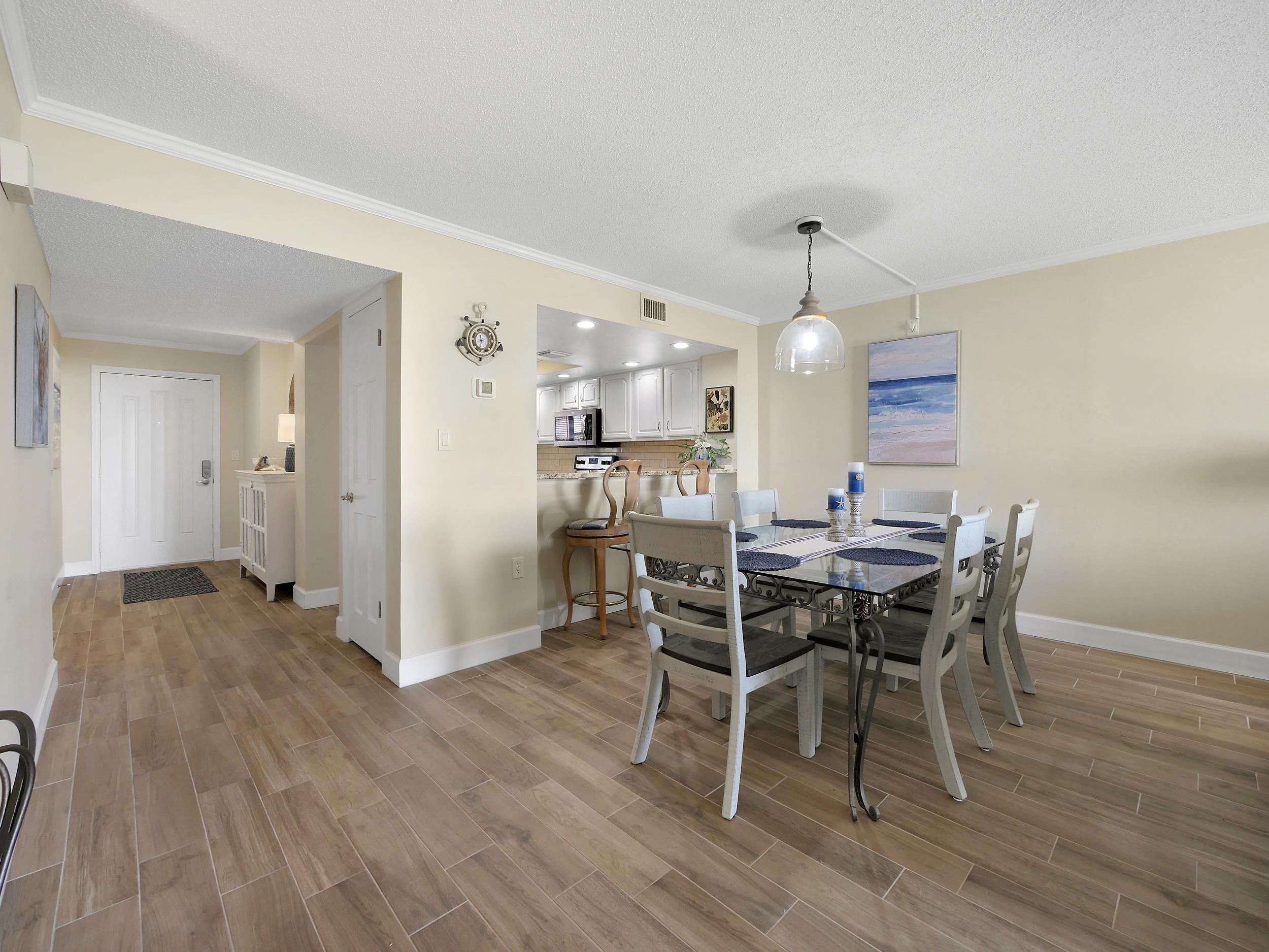 6240 A1A South St. Augustine, FL 32080 - Photo 17 of 44 a view of a dining room with furniture and wooden floor