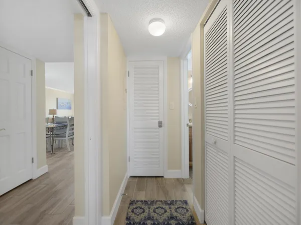 a view of a room with wooden floor