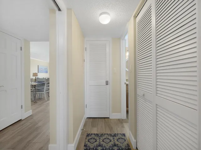 a view of a room with wooden floor