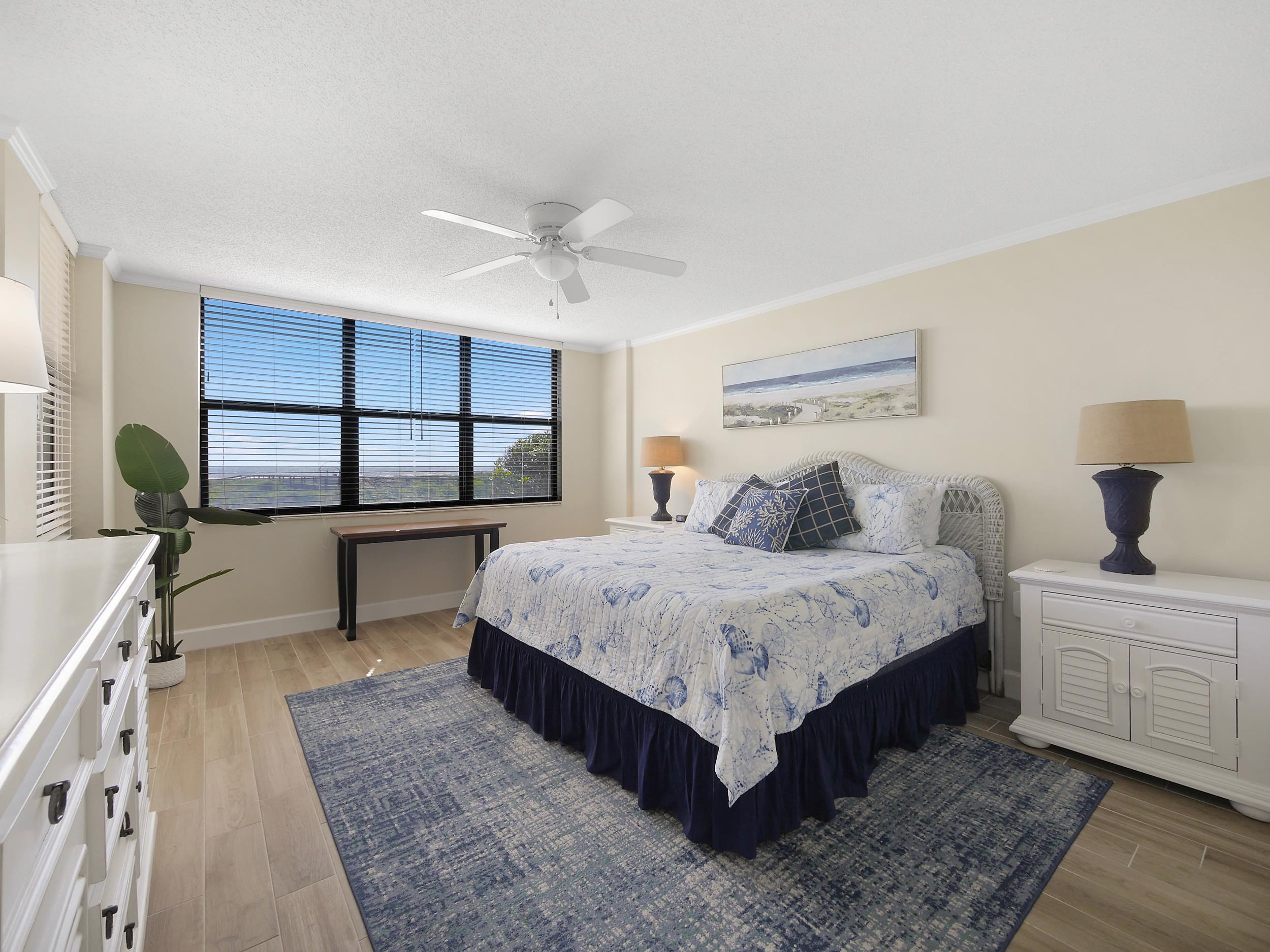 6240 A1A South St. Augustine, FL 32080 - Photo 25 of 44 a bedroom with a bed a mirror and window