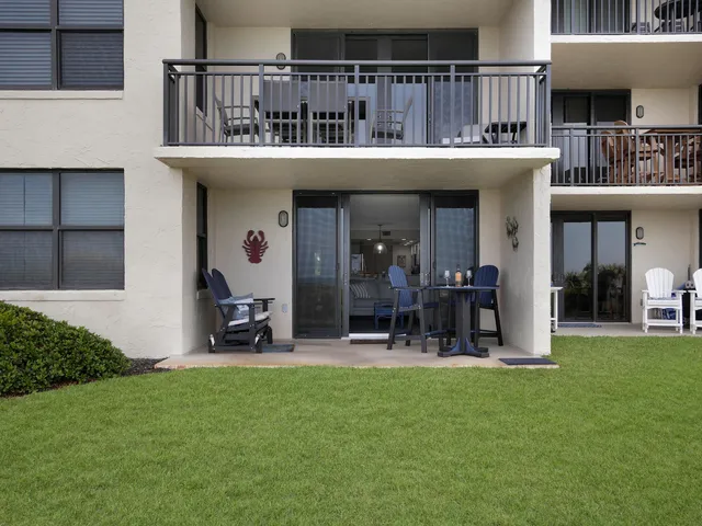 a view of a house with outdoor seating area
