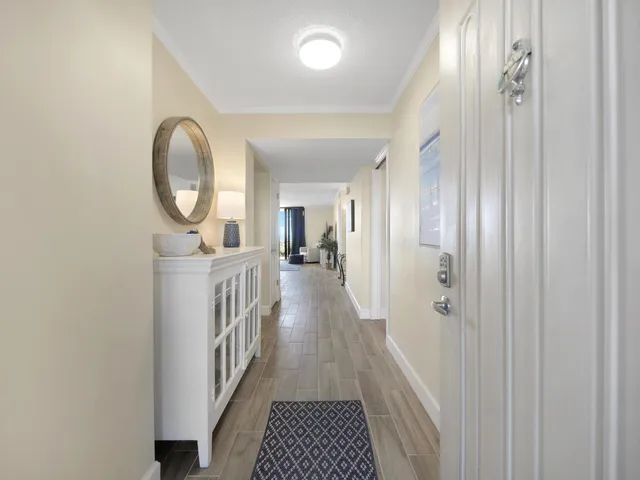 a view of a hallway view with wooden floor and staircase