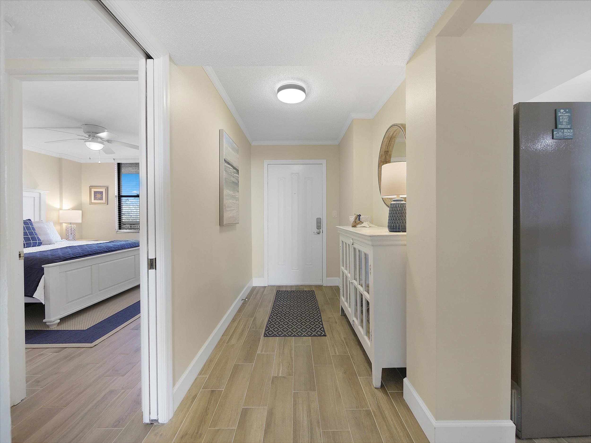 6240 A1A South St. Augustine, FL 32080 - Photo 5 of 44 a view of a hallway view with wooden floor and staircase