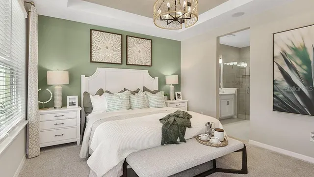 a en suite bathroom with sinks mirror and view