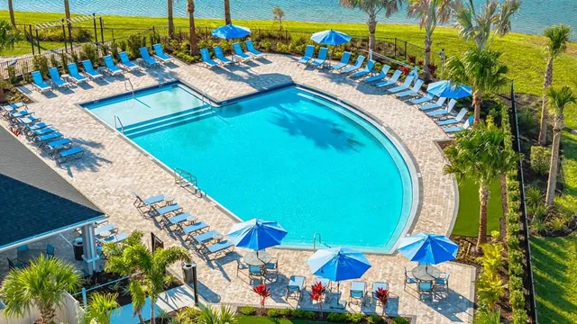 a view of a swimming pool with a patio