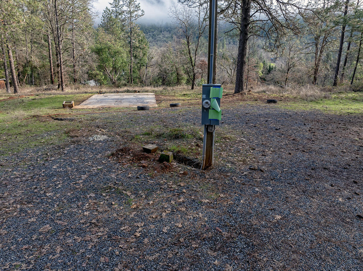 1329 West Evans Creek Road Rogue River, OR 97537 - Photo 4 of 23 a view of a backyard with trees