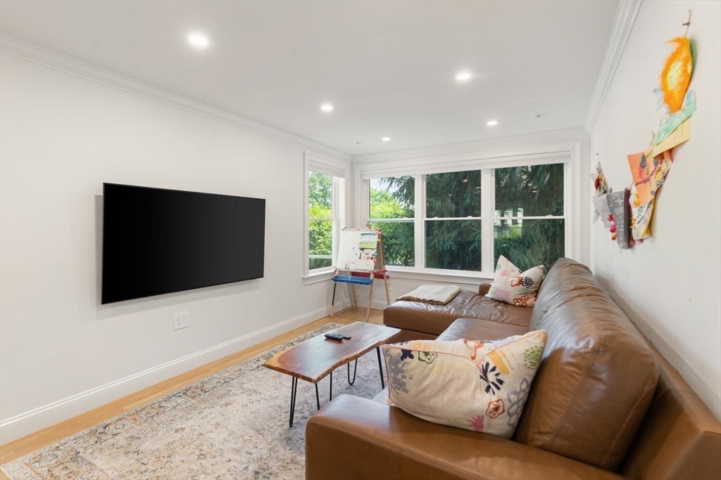 155 Adams Avenue Newton, MA 02465 - Photo 15 of 37 a living room with furniture and a flat screen tv