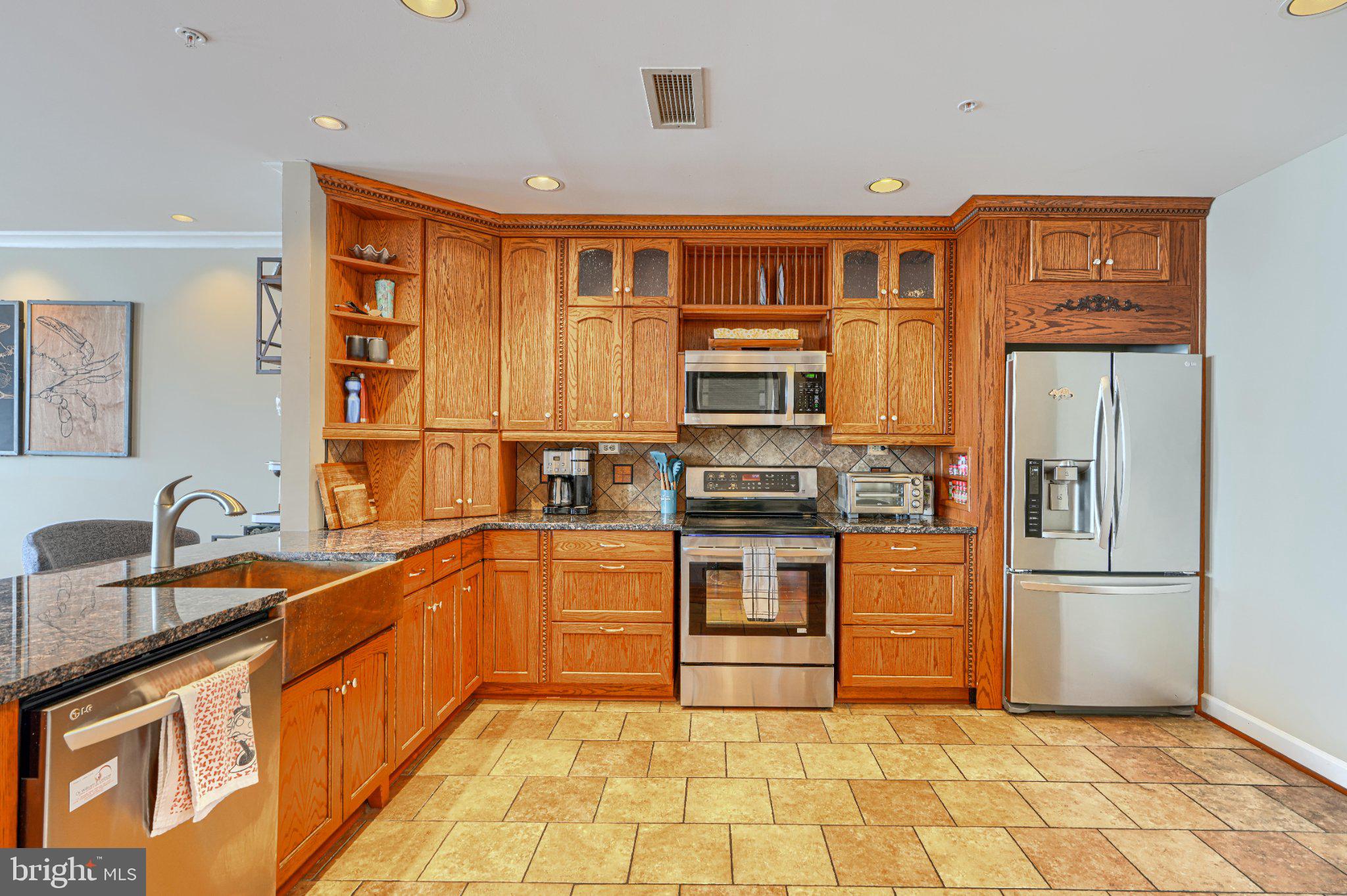1000 Fell Street, Unit 606 Baltimore, MD 21231 - Photo 16 of 56 Warm wood tones in a modern kitchen.