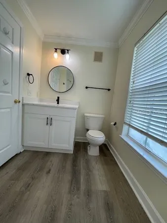 a bathroom with a bathtub and a window