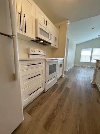 a kitchen with stainless steel appliances a stove and a refrigerator