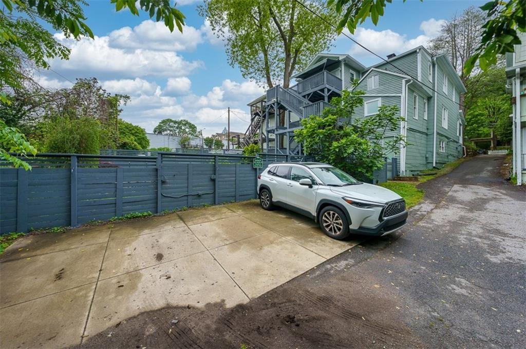 693 Myrtle Street Northeast, Unit 2 Atlanta, GA 30308 - Photo 15 of 17 a front view of a house with garden