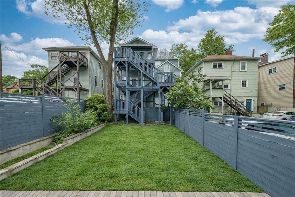 693 Myrtle Street Northeast, Unit 2 Atlanta, GA 30308 - Photo 17 of 17 a view of a house with a backyard